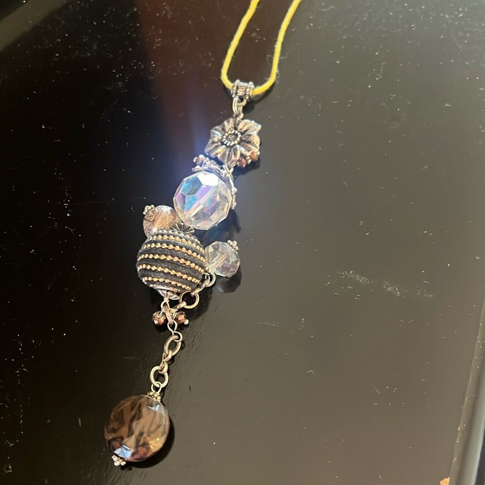 Cute, cute art deco necklace on yellow string cord